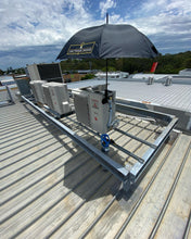 Load image into Gallery viewer, The Trade Shade - Magnetic Umbrella Holder Helping A Tradie Stay Out Of The Sun While Fitting Off A Split System On A Roof.