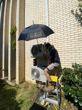 Load image into Gallery viewer, An Australian HVAC Technician Using The Trade Shade - Magnetic Umbrella Holder For Shade In Summer
